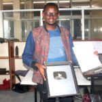 Kenyan YouTube Channel Manager with a Silver Plaque