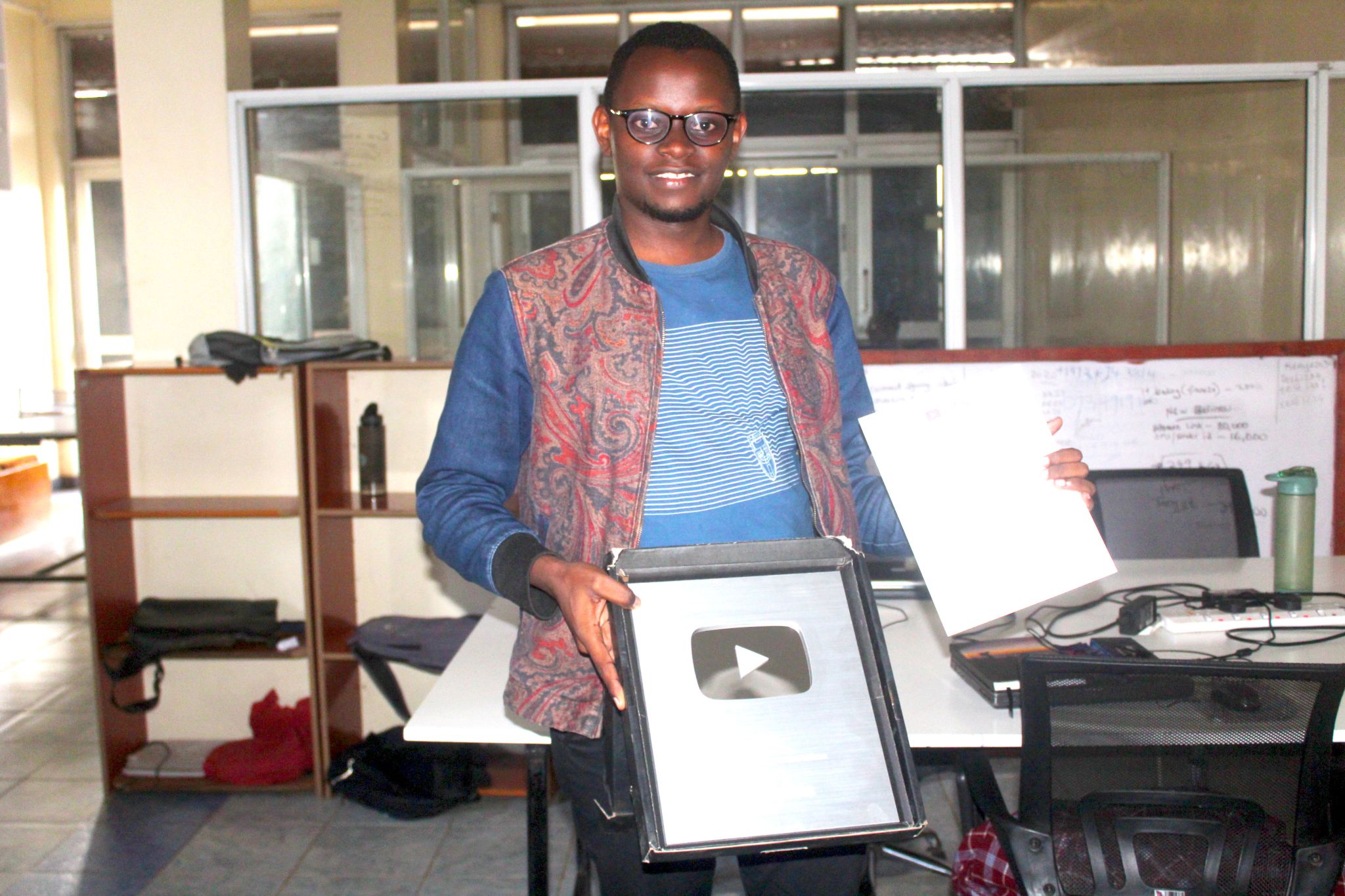 Kenyan YouTube Channel Manager with a Silver Plaque